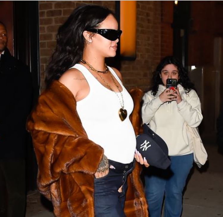 rihanna target shopping fur coat white tank top open jeans timberland boots